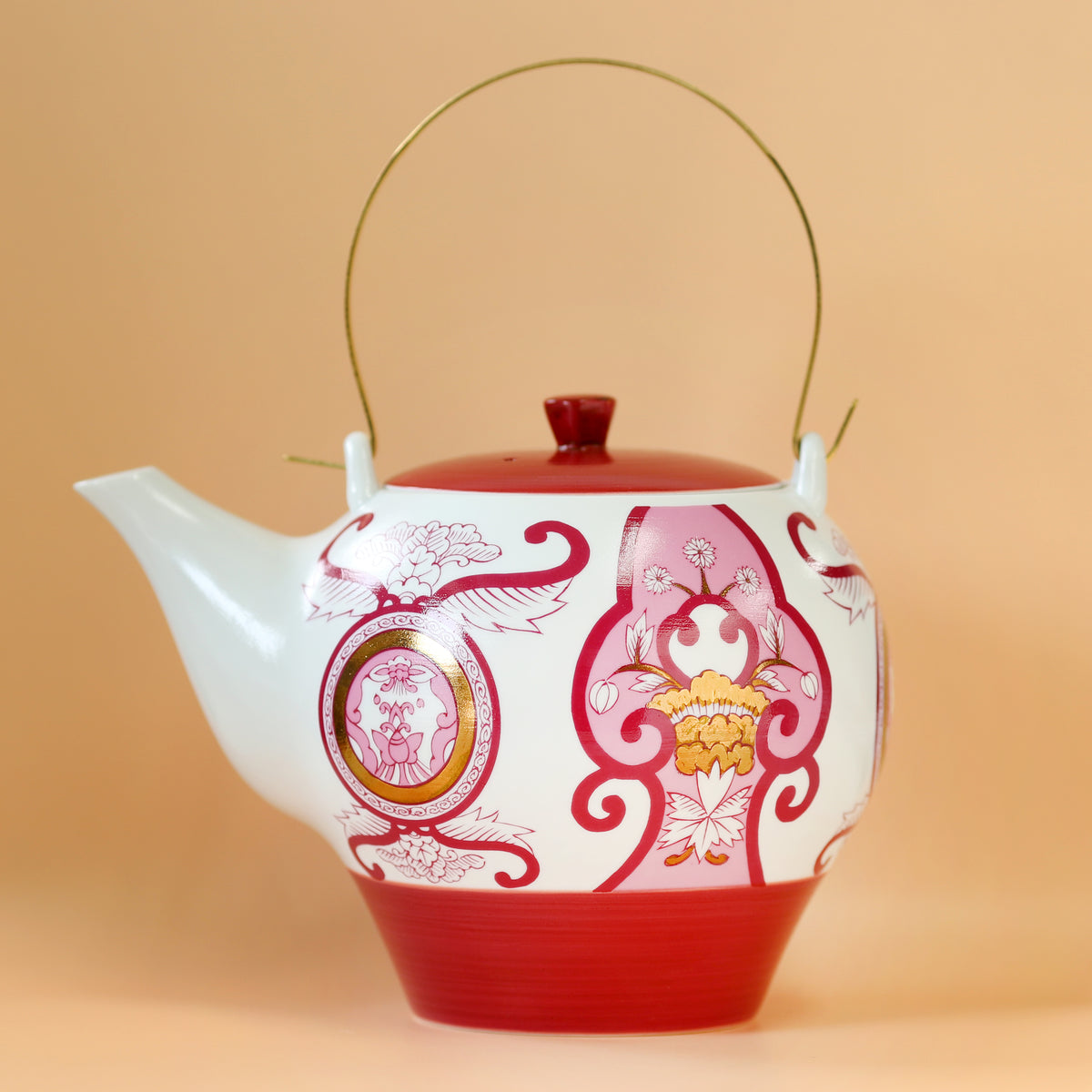 Old Imari floral pattern teapot, wine red.
