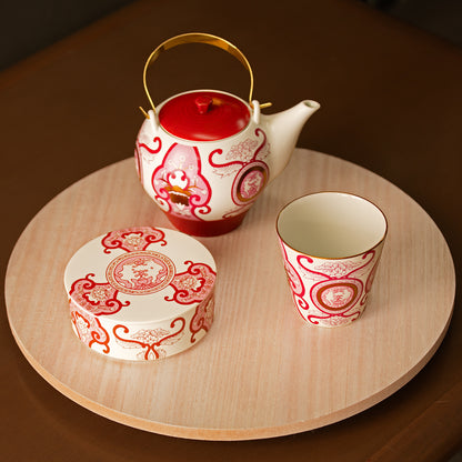 Old Imari floral pattern teapot, wine red.