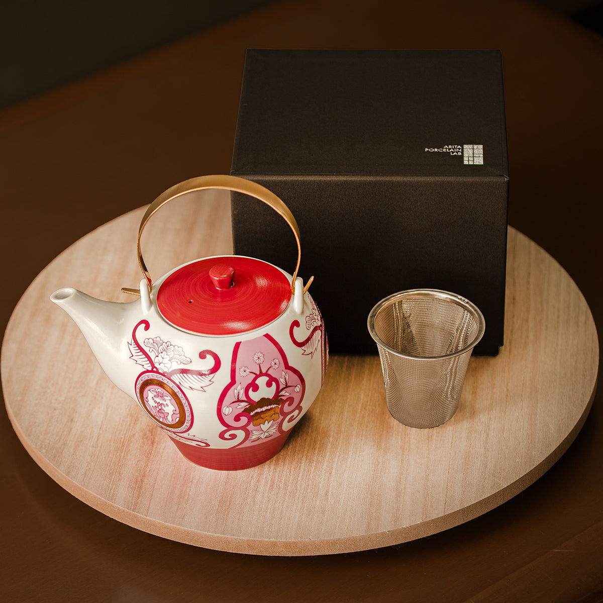Old Imari floral pattern teapot, wine red.
